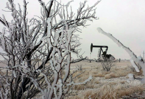 West Texas pump jack in winter scene